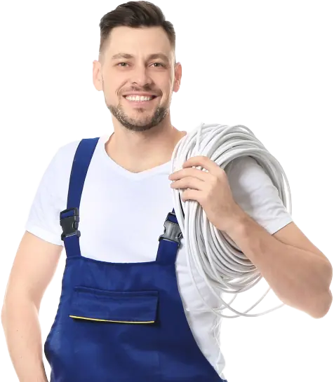 A smiling HVAC technician wearing blue overalls and a white t-shirt, holding a coiled cable over his shoulder.